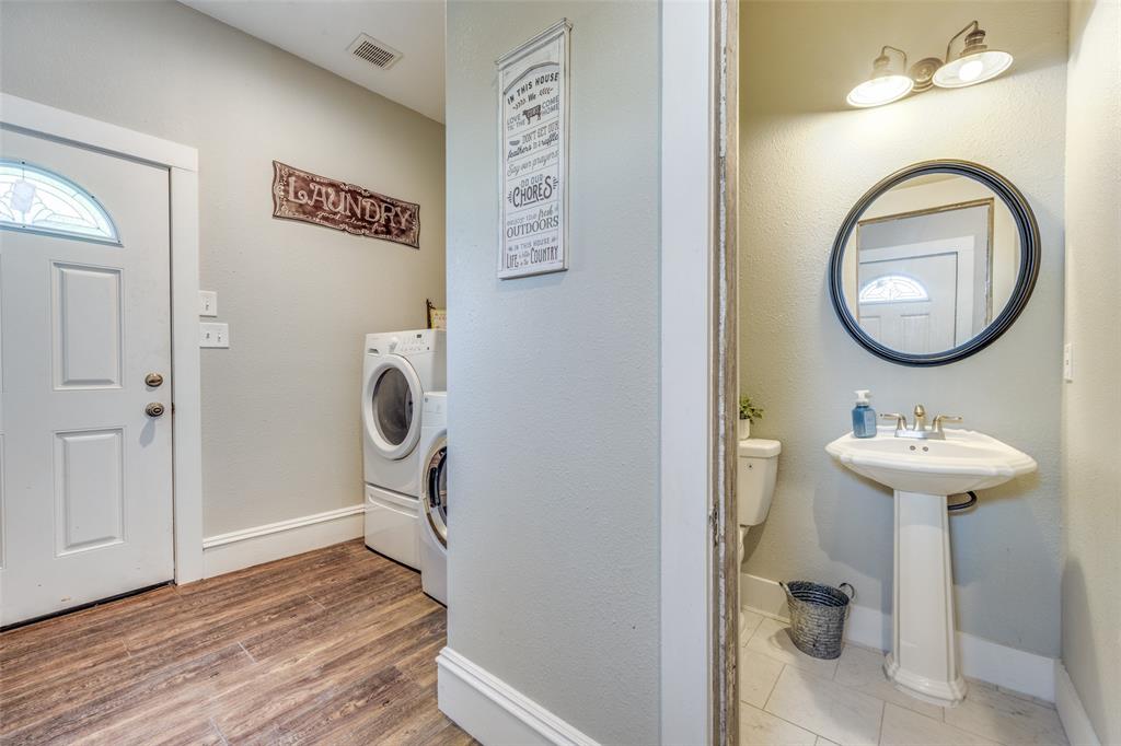 901 North Main Street Leonard, TX 75452 - Photo 12 of 25 a bathroom with a sink and a mirror