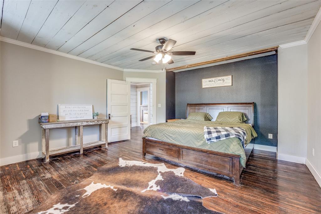 901 North Main Street Leonard, TX 75452 - Photo 16 of 25 a bedroom with a bed and a table