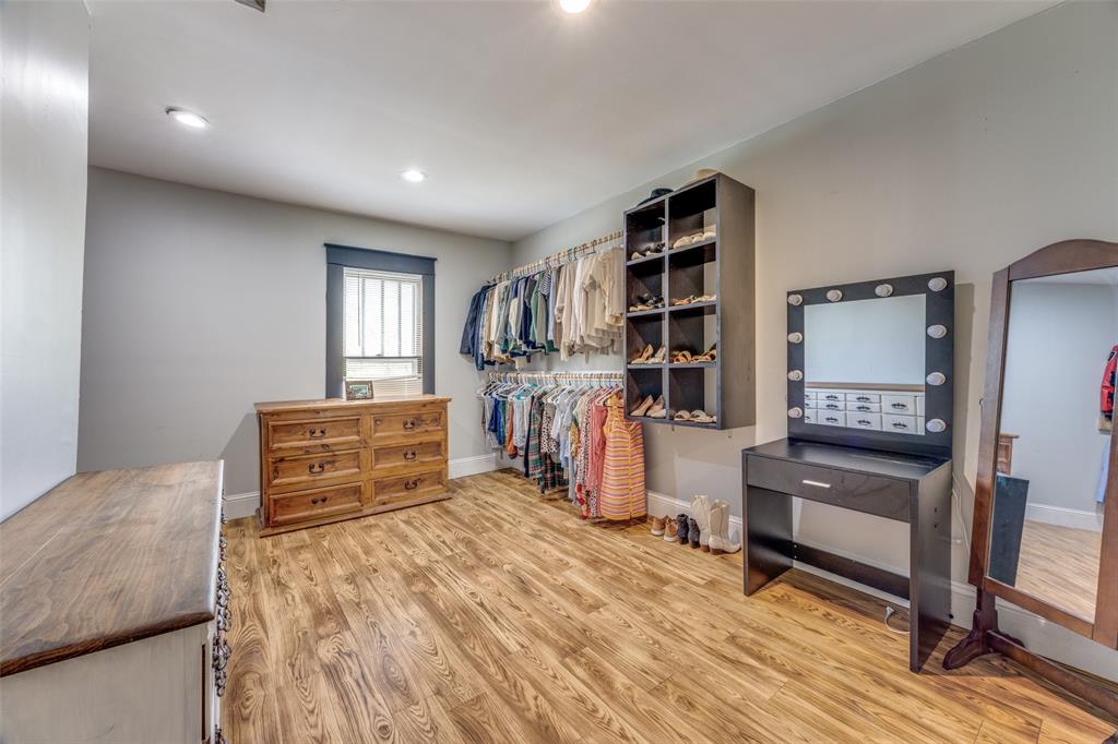 901 North Main Street Leonard, TX 75452 - Photo 18 of 25 a bedroom with furniture and a wooden floor