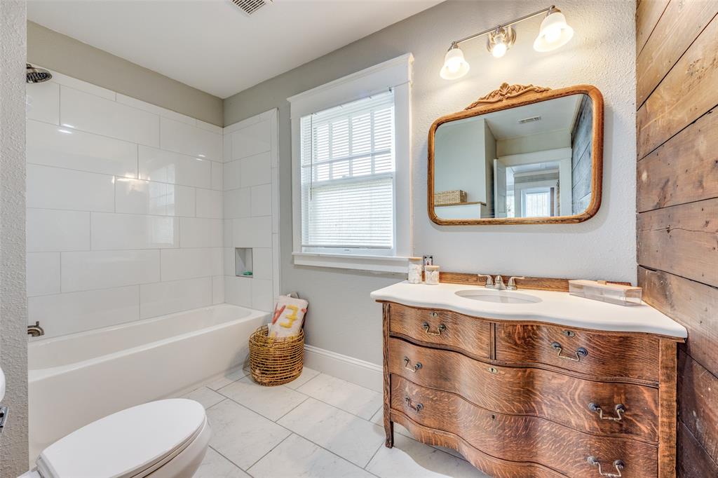 901 North Main Street Leonard, TX 75452 - Photo 23 of 25 a bathroom with a sink and a mirror