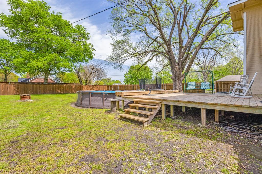 901 North Main Street Leonard, TX 75452 - Photo 24 of 25 a view of a house with backyard and a tree