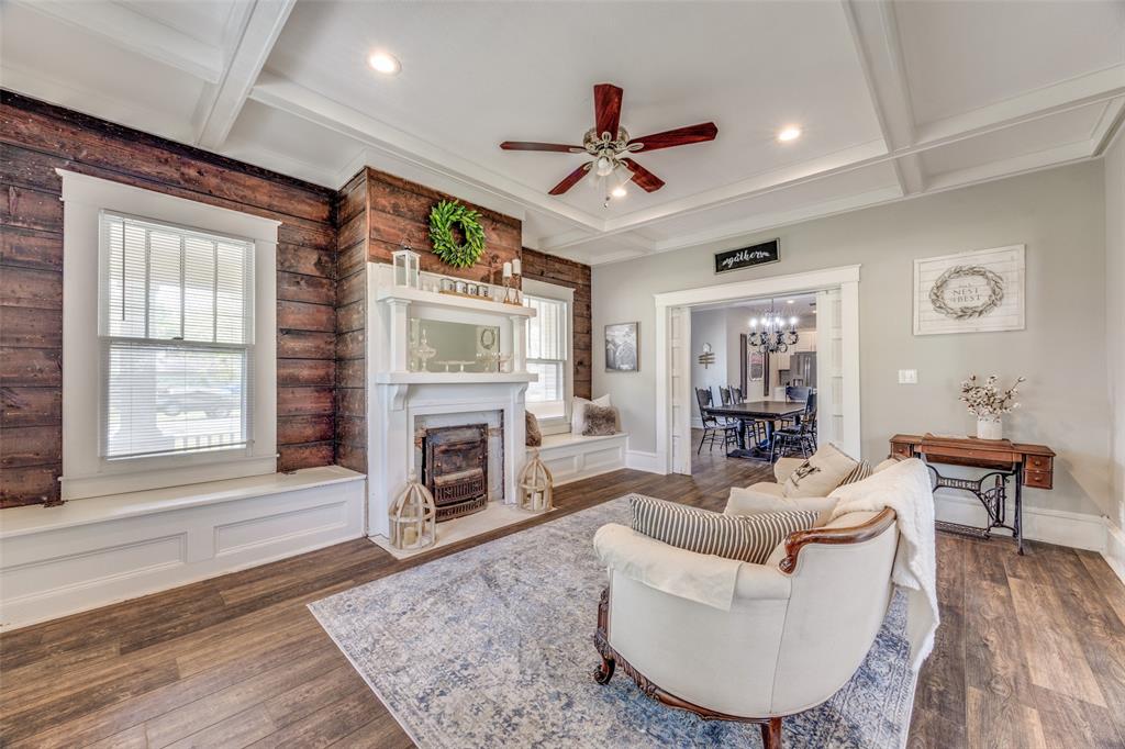 901 North Main Street Leonard, TX 75452 - Photo 4 of 25 a living room with furniture a fireplace and a flat screen tv