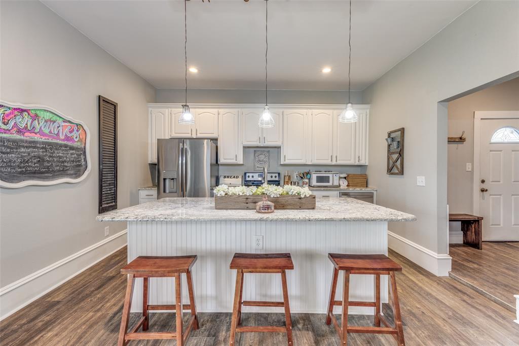 901 North Main Street Leonard, TX 75452 - Photo 8 of 25 a large kitchen with a table and chairs