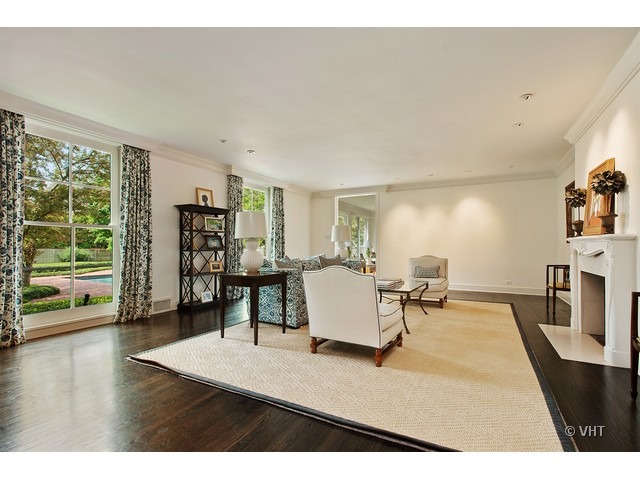 76 Locust Road Winnetka, IL 60093 - Photo 3 of 25 a living room with furniture and a table