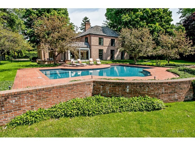 76 Locust Road Winnetka, IL 60093 - Photo 22 of 25 a view of a house with a swimming pool