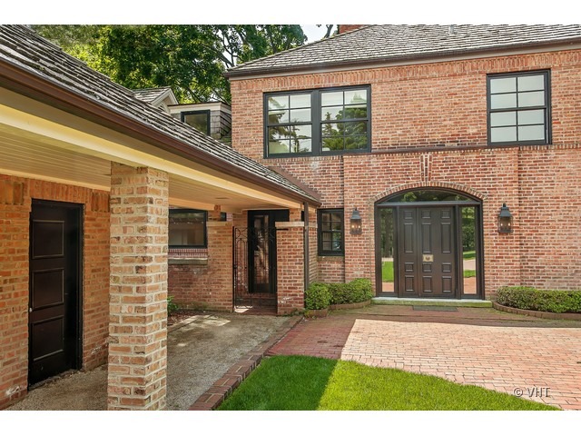 76 Locust Road Winnetka, IL 60093 - Photo 25 of 25 front view of a house with a porch