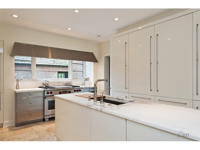 76 Locust Road Winnetka, IL 60093 - Photo 5 of 25 a kitchen with stainless steel appliances granite countertop a sink stove and cabinets