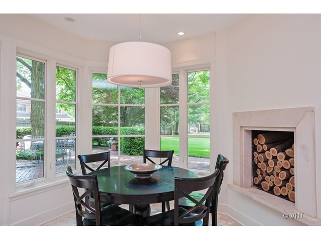 76 Locust Road Winnetka, IL 60093 - Photo 7 of 25 a view of a dining room with furniture window and outside view