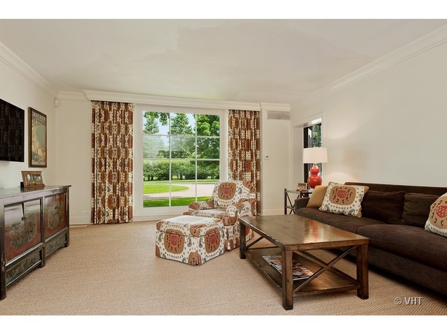 76 Locust Road Winnetka, IL 60093 - Photo 9 of 25 a living room with furniture and a flat screen tv