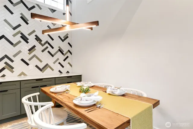 a dining room with furniture and wooden floor