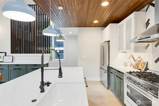 a kitchen with a sink and a stove