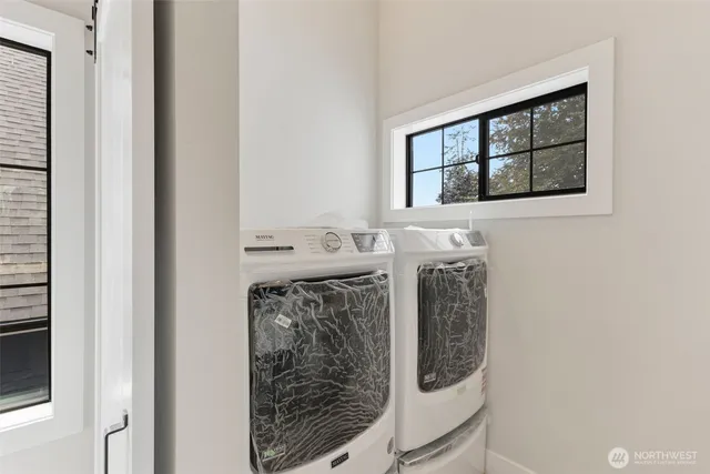 a utility room with dryer and washer