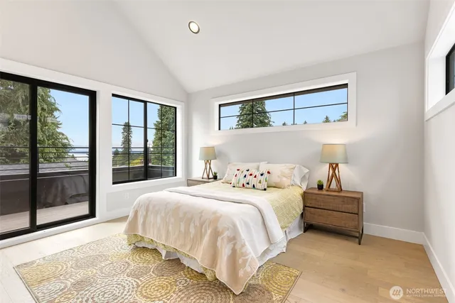 a bedroom with a large bed and a window