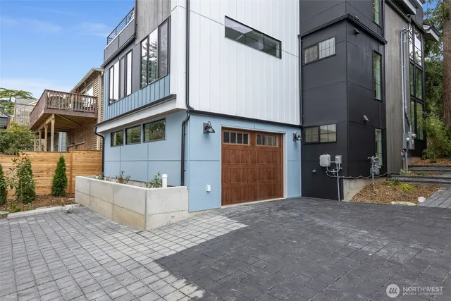 a view of a house with backyard and a tree