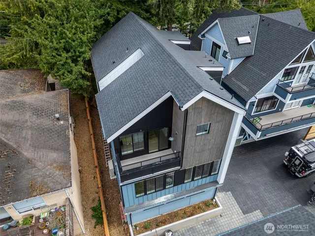 a aerial view of a house with a yard