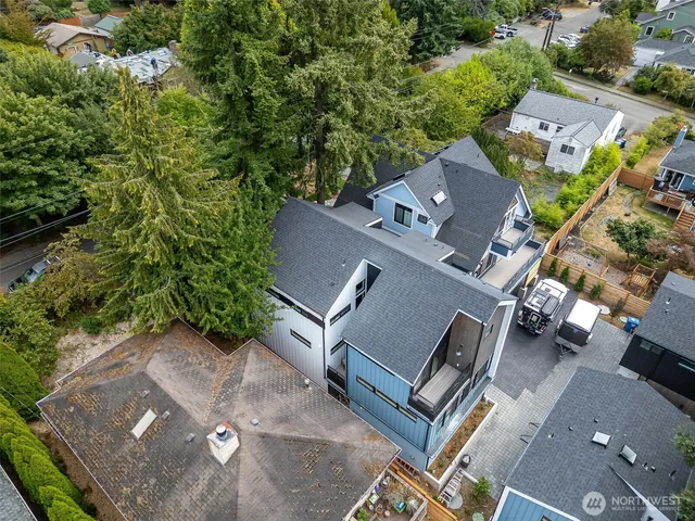 an aerial view of a house with a yard