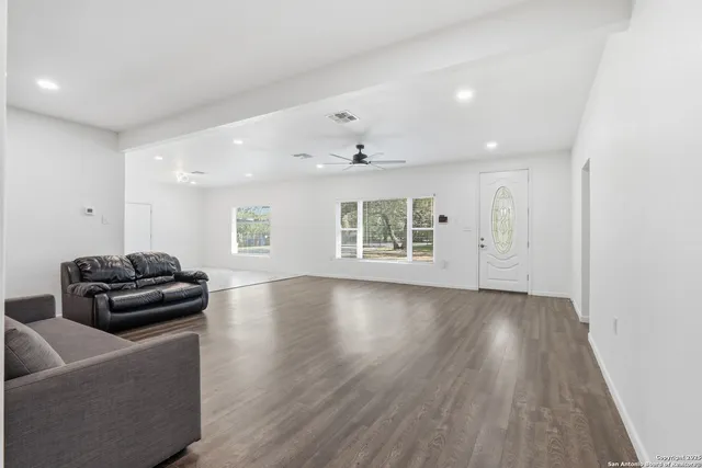 a view of a livingroom with furniture and wooden floor
