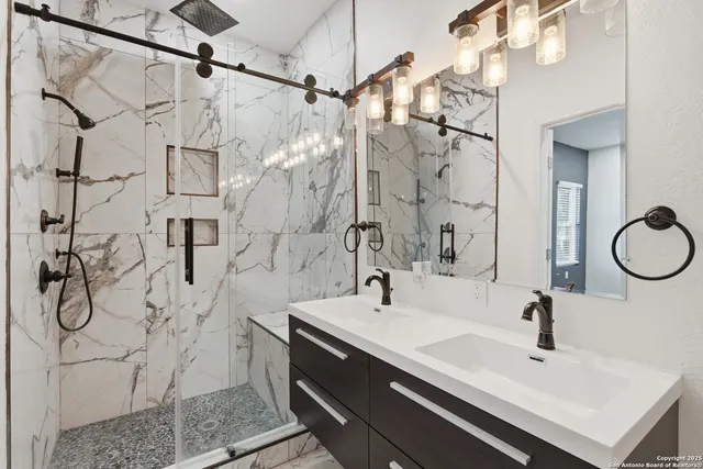 a bathroom with a sink and a mirror