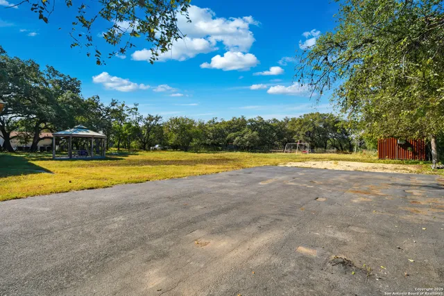 a view of a swimming pool with an outdoor space and seating area
