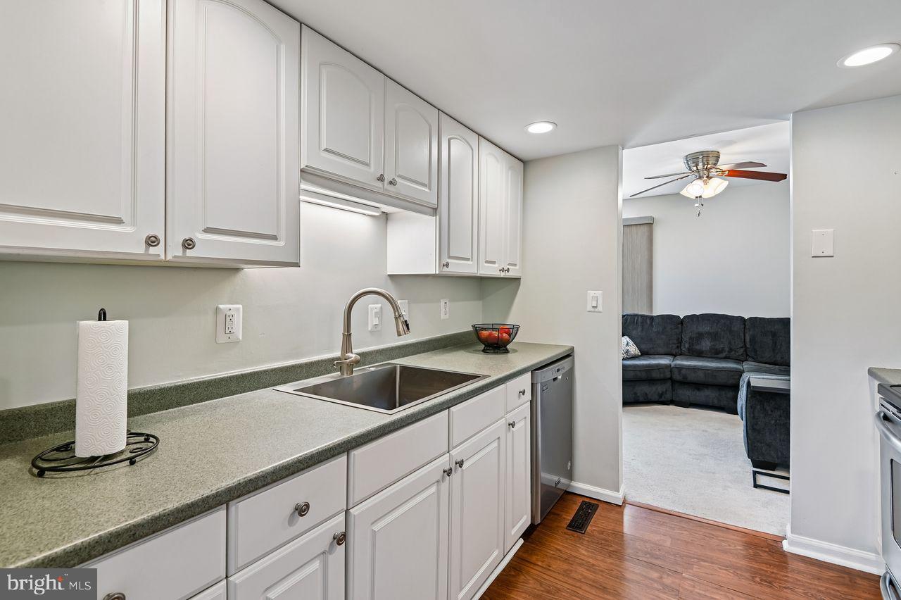 746 Match Point Drive Arnold, MD 21012 - Photo 11 of 52 a kitchen with granite countertop a sink and cabinets