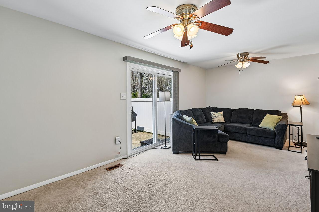 746 Match Point Drive Arnold, MD 21012 - Photo 13 of 52 a living room with furniture and a ceiling fan
