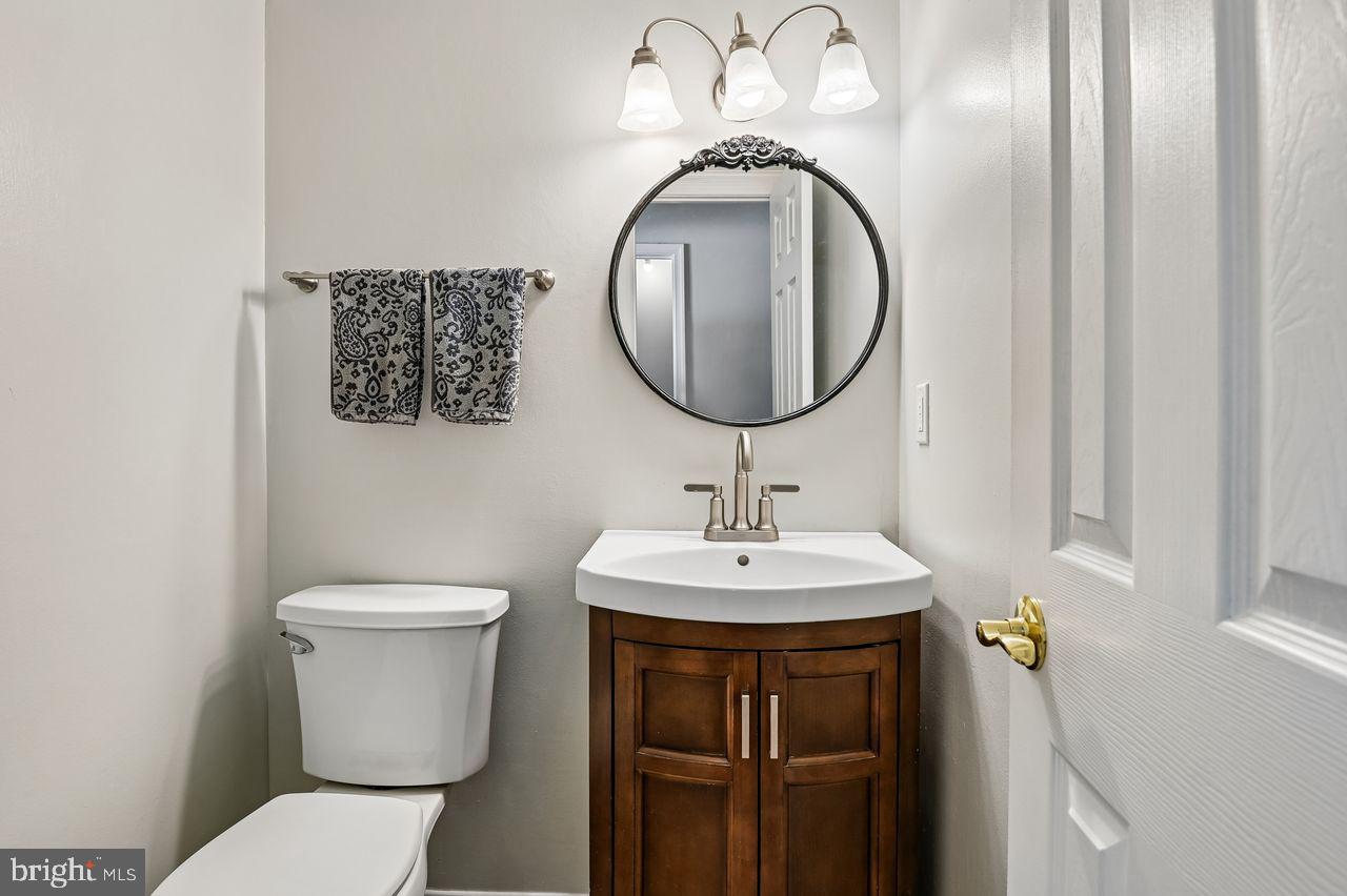 746 Match Point Drive Arnold, MD 21012 - Photo 16 of 52 a bathroom with a toilet and a sink