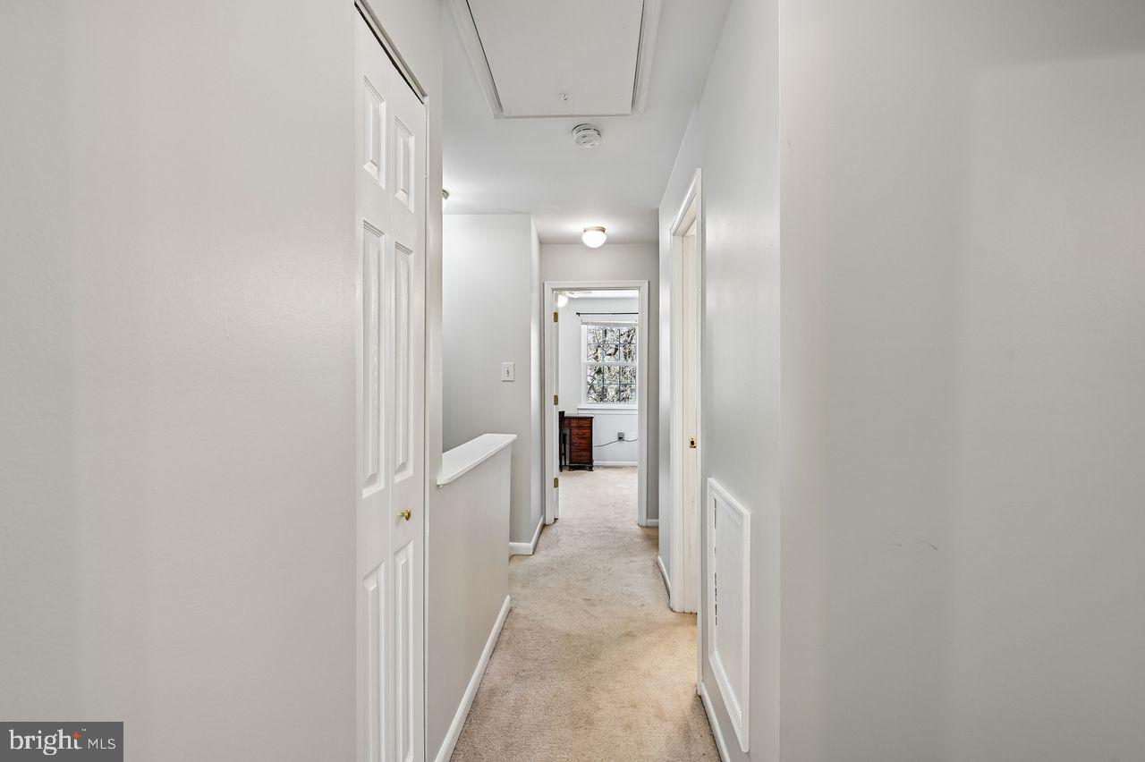 746 Match Point Drive Arnold, MD 21012 - Photo 19 of 52 a view of a hallway with wooden shelves