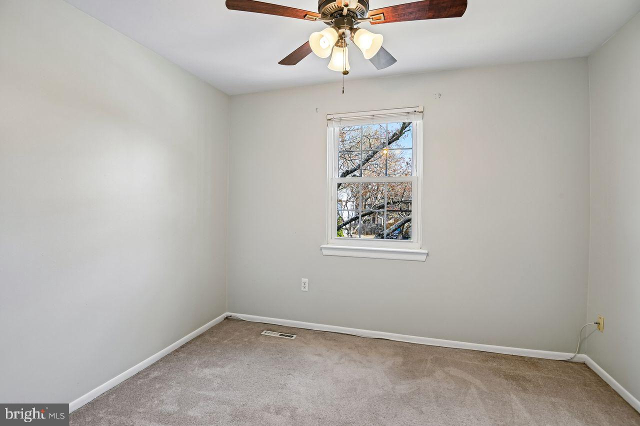 746 Match Point Drive Arnold, MD 21012 - Photo 24 of 52 an empty room with a window and a fan