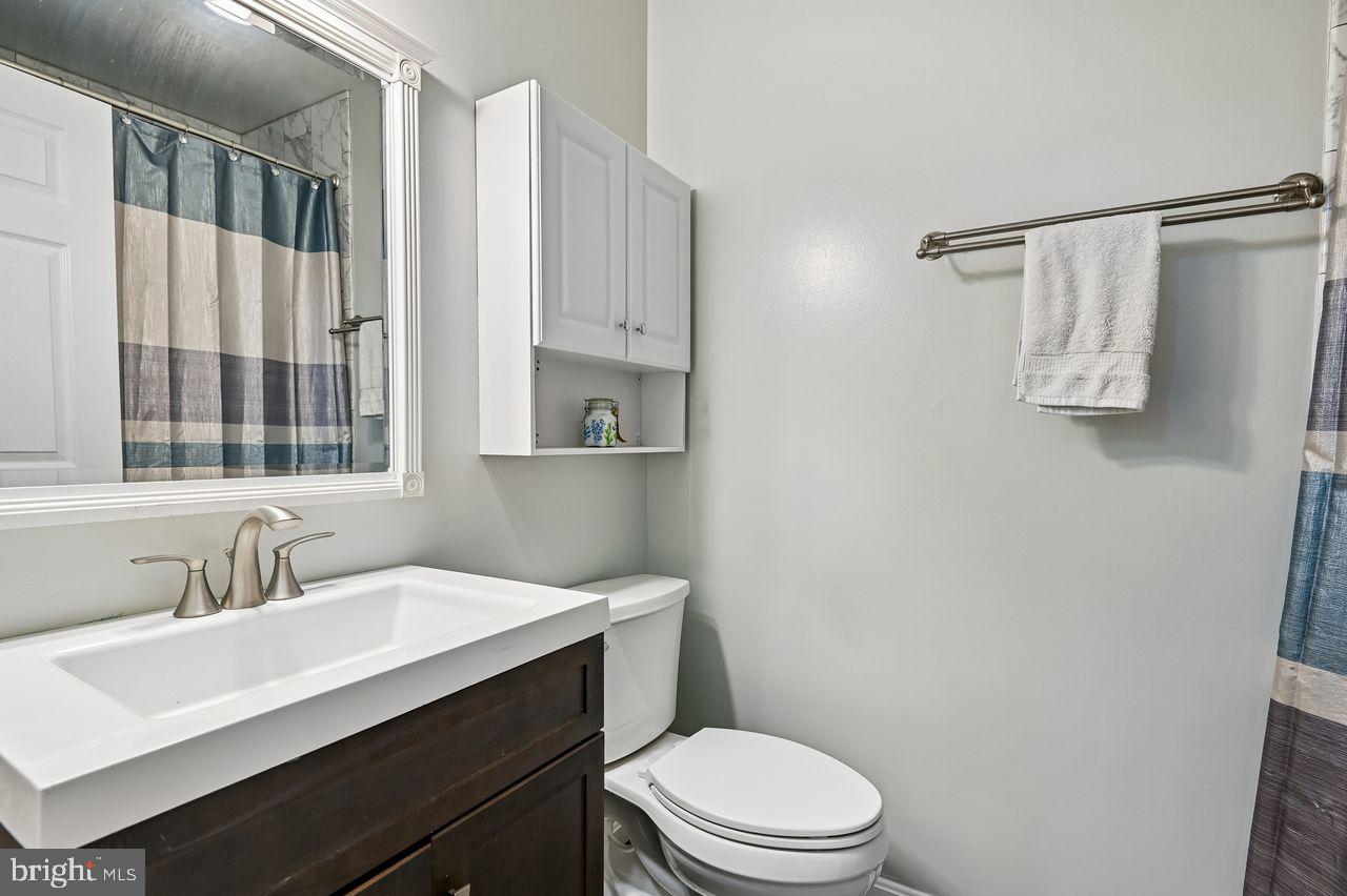 746 Match Point Drive Arnold, MD 21012 - Photo 30 of 52 a bathroom with a sink vanity mirror and toilet