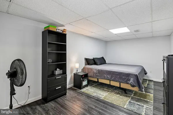 a spacious bedroom with a bed and a table