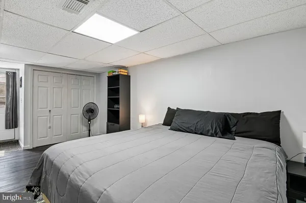 a view of walk in closet with clothes