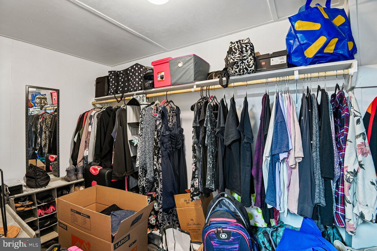 746 Match Point Drive Arnold, MD 21012 - Photo 35 of 52 a view of walk in closet with clothes