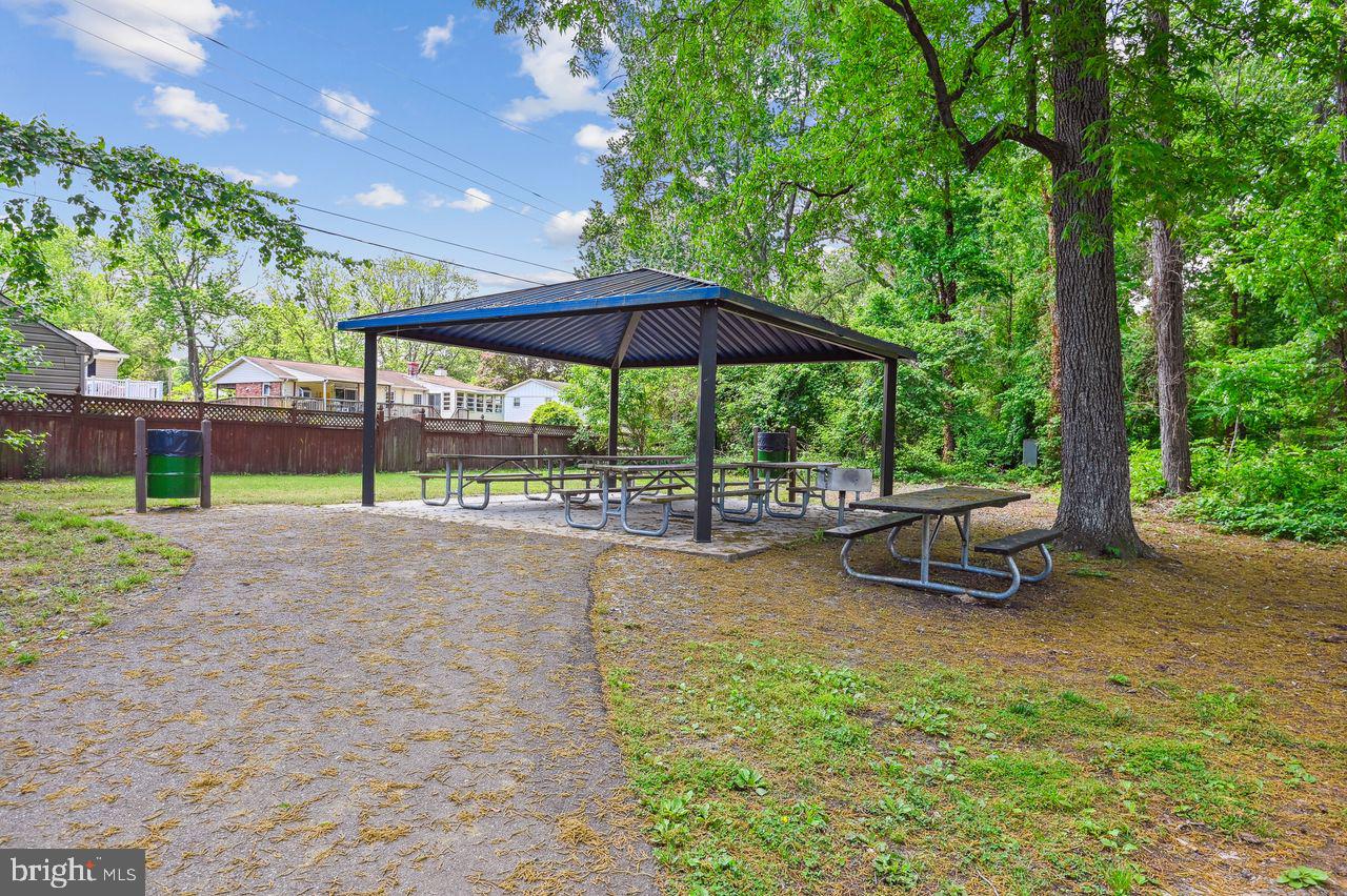 746 Match Point Drive Arnold, MD 21012 - Photo 48 of 52 a view of patio with a table and chairs under an umbrella