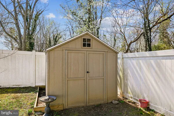a house with trees in the background