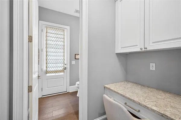 a view of a house with a swimming pool and a yard