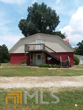 25 Appalachee Church Road, Unit 2 Auburn, GA 30011 - Photo 1 of 1 a view of a big house with a big yard