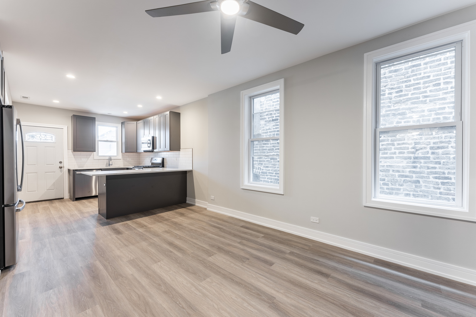 1725 North Honore Street, Unit 2R Chicago, IL 60622 - Photo 5 of 9 a view of kitchen with wooden floor and window