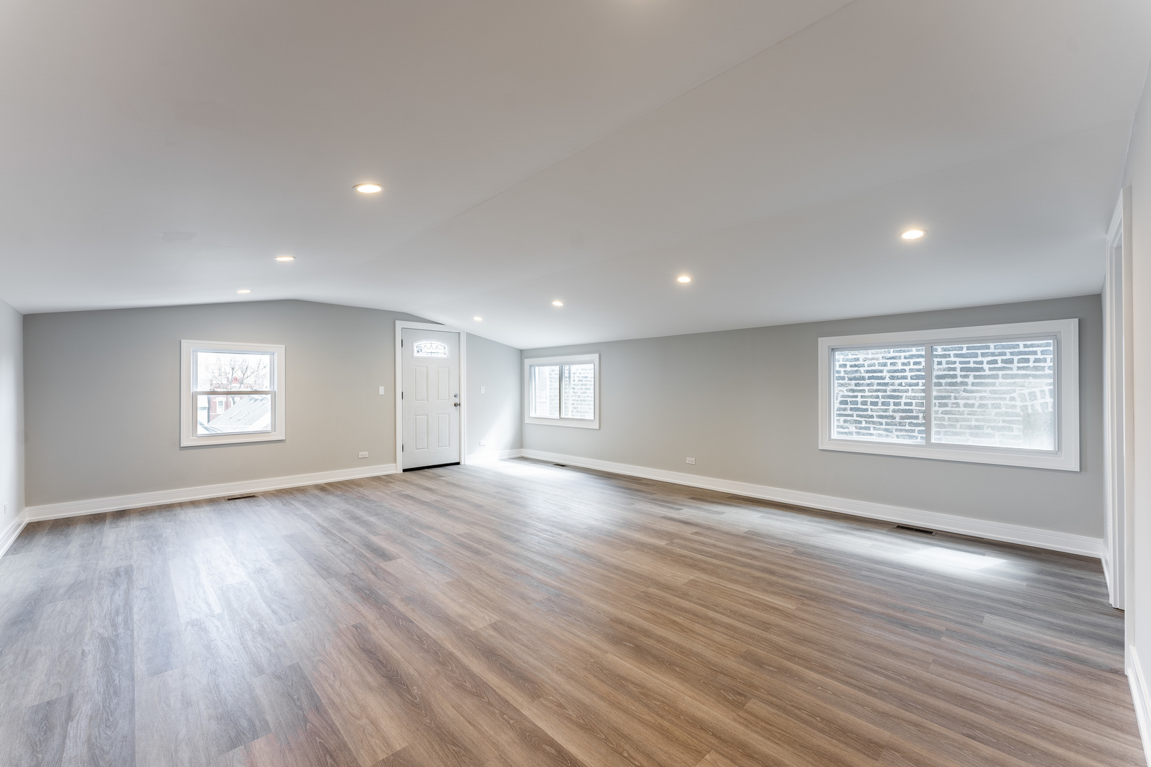 1725 North Honore Street, Unit 2R Chicago, IL 60622 - Photo 9 of 9 an empty room with wooden floor and window