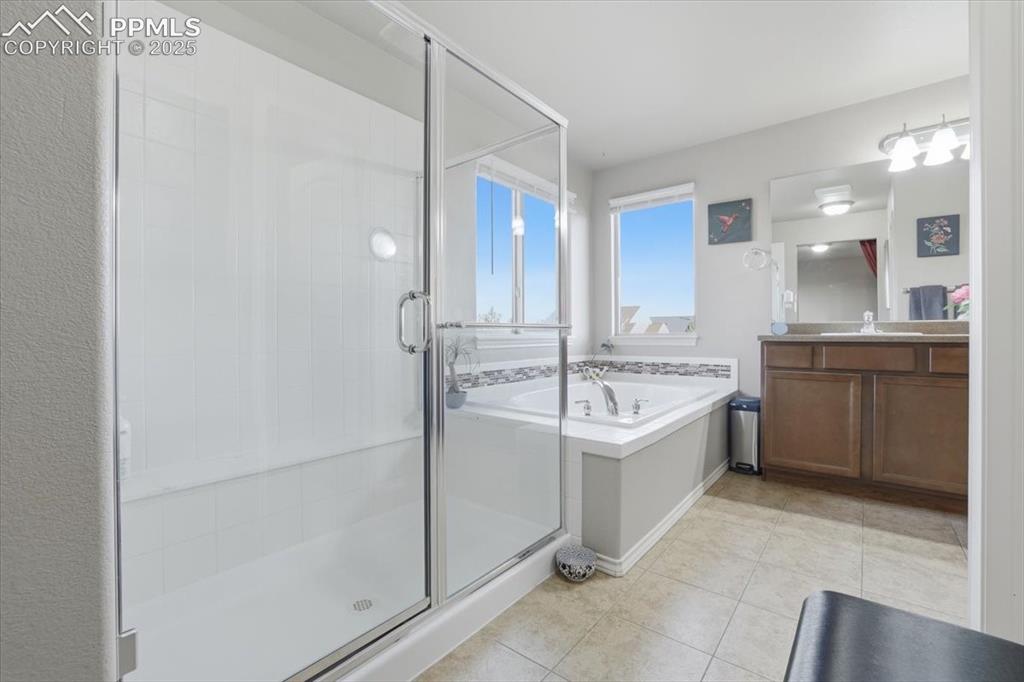 2374 Cinnabar Road Colorado Springs, CO 80921 - Photo 32 of 48 The primary bathroom is spacious and filled with natural light.