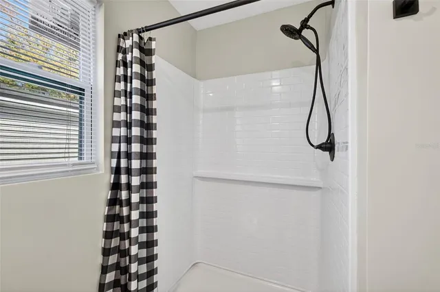 a view of a hallway with washer and dryer
