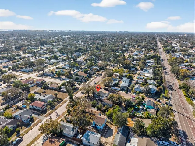 an aerial view of a house with a garden