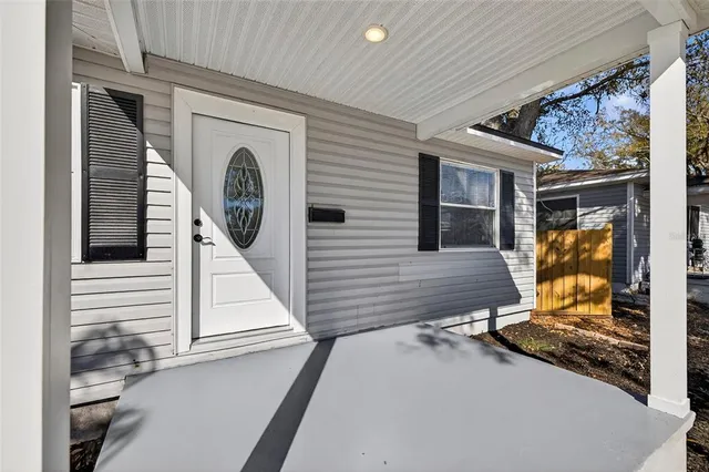 a living room with furniture and windows