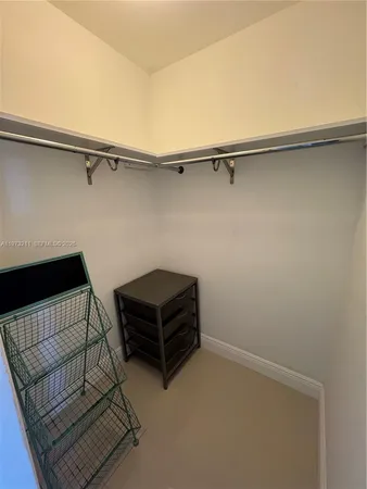 view of room with racks on the wall