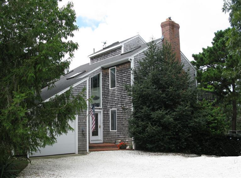 20 Massasoit Road Wellfleet, MA 02667 - Photo 1 of 35 a view of a house with a backyard