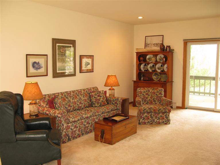 20 Massasoit Road Wellfleet, MA 02667 - Photo 11 of 35 a living room with furniture and a window