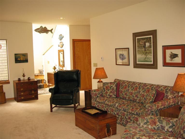 20 Massasoit Road Wellfleet, MA 02667 - Photo 12 of 35 a living room with furniture and a flat screen tv