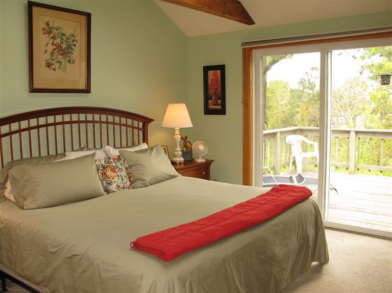 20 Massasoit Road Wellfleet, MA 02667 - Photo 13 of 35 a bedroom with a large bed and a window