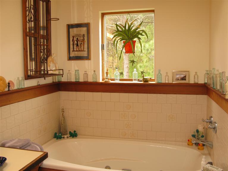 20 Massasoit Road Wellfleet, MA 02667 - Photo 14 of 35 a bathroom with a bathtub and a window