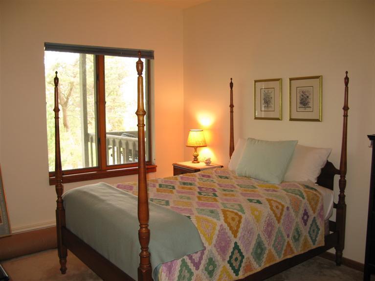 20 Massasoit Road Wellfleet, MA 02667 - Photo 15 of 35 a bedroom with a large bed and a window