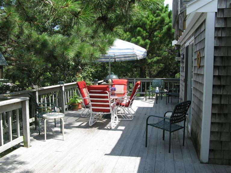 20 Massasoit Road Wellfleet, MA 02667 - Photo 19 of 35 a patio with glass top table and chairs